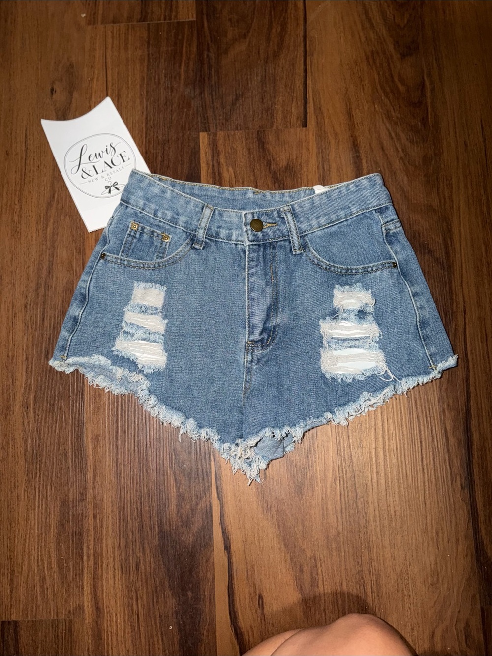 Distressed Women's Denim Shorts in Light Blue